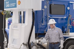 Truck driver fueling up at a Shell LNG pump