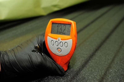 Line-X checks thickness at several areas of the bed to ensure material is at proper depth after application.