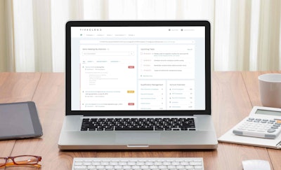 Blank screen laptop computer on wooden table