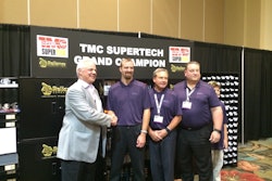 Eric Vos (center) is congratulated by FedEx Freight president and CEO Mike Ducker, Pat Reed, executive Vice President and COO, and John Smith, senior Vice President of operations, at TMC’s 2015 SuperTech competition.