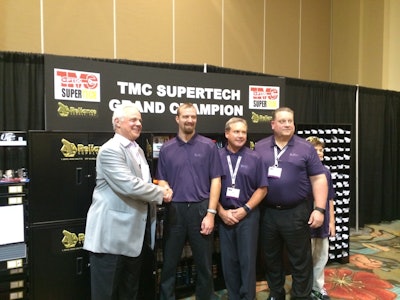 Eric Vos (center) is congratulated by FedEx Freight president and CEO Mike Ducker, Pat Reed, executive Vice President and COO, and John Smith, senior Vice President of operations, at TMC’s 2015 SuperTech competition.