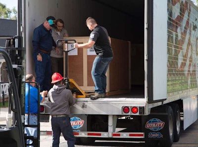C.R. England driver Brent Sanger (front, far left inside trailer) and his wife, Carol, drove 2,000 miles to bring the “Victory from Within: The American Prisoner of War Experience,” to the Fort Douglas Military Museum in Salt Lake City on Oct. 19.