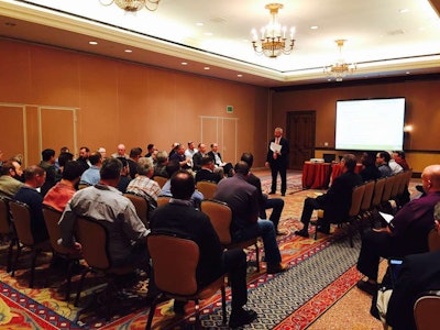 Moseley speaking at the 2015 CCJ Fall Symposium.