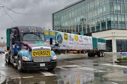 Lynden Transport driver John Schank makes a turn in the Belltown District of Seattle as it makes its way to Lake Union Park.