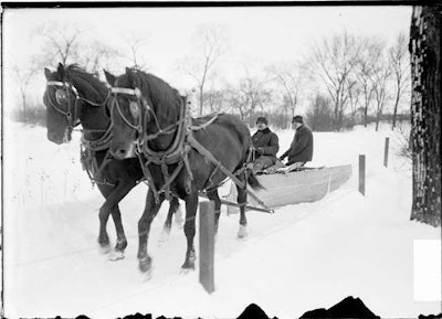 It was only 2 hp, but it got the job done plowing the snow back in 1903 in Lincoln Park, Chicago. What! No heated cab?! (Photo from the Library of Congress.)