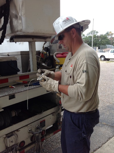 John D. Gibbs and his utility truck are often in harm’s way when it comes to repairing power problems. But it’s not the high voltage that causes the most concern.