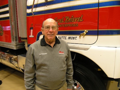 After nearly 60 years of service to Mack Trucks, Don Schumaker says he’s ready to retire. Here he’s pictured in his final role as Mack Museum curator emeritus. Behind him is Evel Knievel’s 1974 Mack FS786LST.