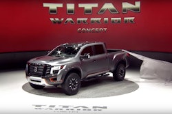 Titan Warrior won a tug of war contest–at least briefly–with a stage hand this week at the Detroit Auto Show. The truck’s reveal cover is shown here stuck on the corner of the truck bed.