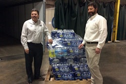 Kevin Burch, president of Jet Express (left), sparked an initiative that has delivered 340,000 bottles of fresh water to Flint, Mich.