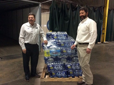 Kevin Burch, president of Jet Express (left), sparked an initiative that has delivered 340,000 bottles of fresh water to Flint, Mich.