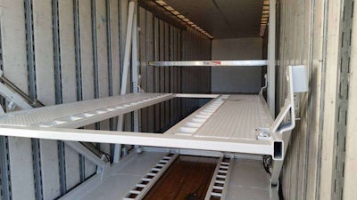 Shown is a module unit with both upper deck tracking and lower level tracking. Open bottom modules are also available in which the lower level vehicle tires park directly on the van floor.
