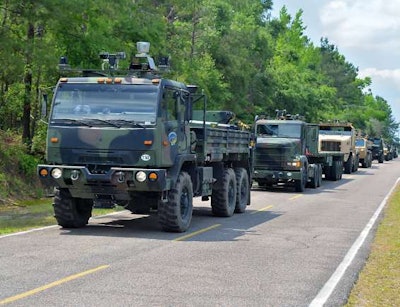 The Army will be testing its autonomous trucks for the first time on a public road with civilian vehicles in June. The autonomous Army trucks above were used in a test conducted at a Department of Energy site in 2014.