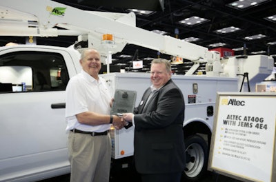 Altec Industries won NTEA’s Green Award for its JEMS 4 utility truck. Left to right: William Callis, senior account manager of telecommunications; Steve Carey, executive director, NTEA