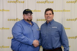 Julian Kaczor, left, being congratulated by Goodyear Marketing Director Gary Medalis for being named the 2016 Highway Hero in March.