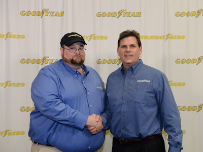 Julian Kaczor, left, being congratulated by Goodyear Marketing Director Gary Medalis.