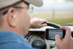 Man behind the wheel while texting