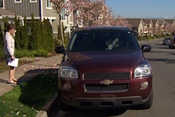 King County Councilmember Kathy Lambert stands next to a Chevrolet Uplander shortly before donating it to Life Enrichment Options. (Screen shot from king5.com.)