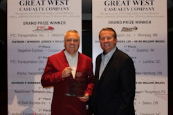 Bison Transport’s Garth Pitzel, left, was named the 2016 TCA Safety Professional of the Year. He’s shown with TCA President John Lyboldt.
