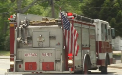 A Central Coventry Fire District truck displaying the U.S. flag.