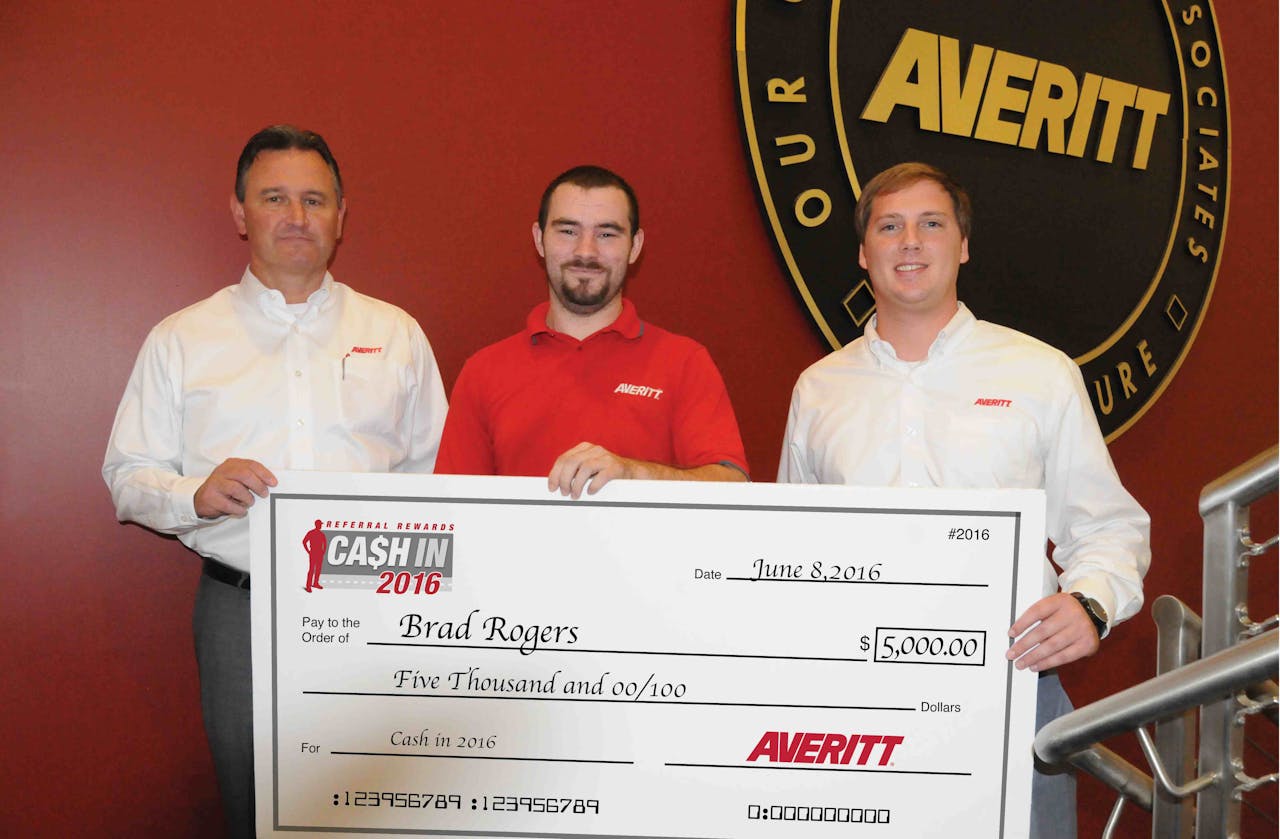 Averitt Express driver Brad Rogers (center) shows off his $5,000 prize that he won as part of the company’s Cash In 2016 referral program. Also pictured are (left) Danny Crooks, Averitt’s vice president of corporate transportation; and Bryan Shirley, Rogers’ fleet manager.