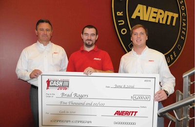 Averitt Express driver Brad Rogers (center) shows off his $5,000 prize that he won as part of the company’s Cash In 2016 referral program. Also pictured are (left) Danny Crooks, Averitt’s vice president of corporate transportation; and Bryan Shirley, Rogers’ fleet manager.