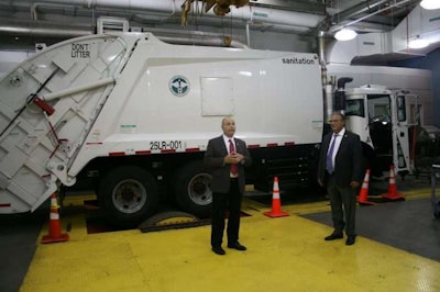 New York City Department of Sanitation has its own dynamometer, shown here with a Mack LR truck, which will be used to test renewable diesel. DSNY Fleet Supervisor Spiro Kattan, on the left, talked with reporters about the dyno last week. On the right is DSNY Deputy Commissioner Rocco DiRico.