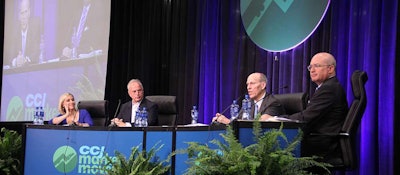 Alain Bedard, chairman and CEO of Transforce, and David Parker, president of Covenant Transportation Group, (second and third from left) discuss how e-commerce will affect the future of the trucking industry at the CCJ Market Movers program at the Great American Trucking Show in Dallas.