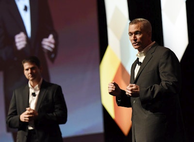 Dave Wangler (right), president of TMW Systems, and Brian McLaughlin, president of PeopleNet.