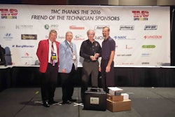 Vos, far right, is congratulated by TMC SuperTech Chairman George Arrants. Joining them was TMC Chairman Doug White, far left, and Winston Minchew, Chairman of PTDC and training manager for Old Dominion.