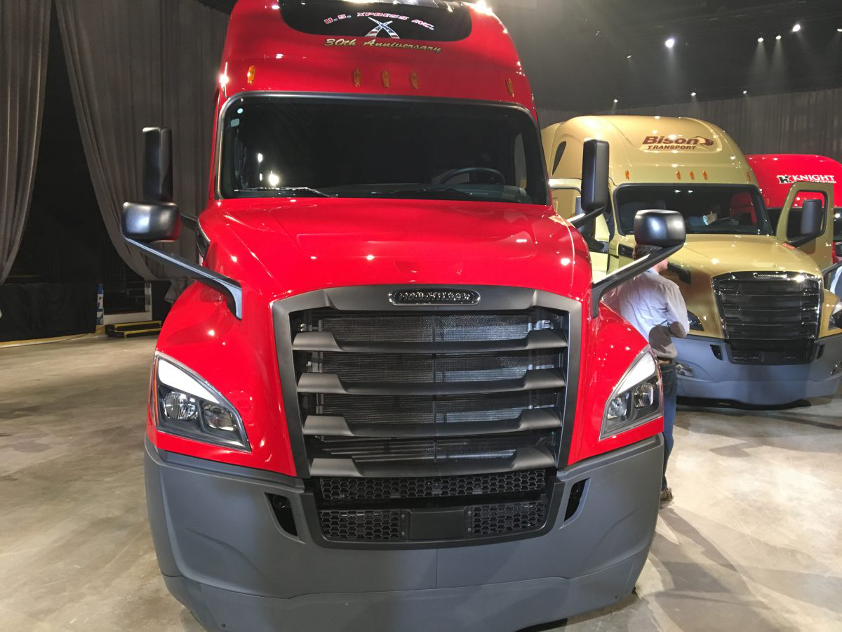 Freightliner truck next to other trucks