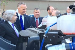 Göran Nyberg (second from left), president of Volvo Trucks North America details some of the company’s SuperTruck specs to U.S. Secretary of Energy Dr. Ernest Moniz (far left).