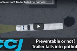 trailer falls into pothole