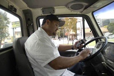 Truck driver in cab of his truck