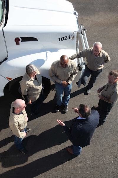 David Orscheln talks to a group of drivers, who can now be home every night while averaging more than 2,500 miles per week.