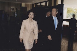 Elaine Chao, left, walks with former President George W. Bush during her time as Secretary of Labor, a post she held from 2001-2009. (Photo courtesy of Chao’s Flickr account.)