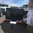 Greg O’Connor, Nextran Truck Center’s director of service operations, demonstrates how the company’s diagnostics platform reads fault data from the truck.
