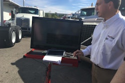 Greg O’Connor, Nextran Truck Center’s director of service operations, demonstrates how the company’s diagnostics platform reads fault data from the truck.