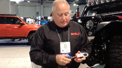 Steve Gilles, director of new business development at Strattec, Bolt’s parent company, demonstrates Bolt’s single key technology at SEMA.