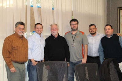 The business intelligence scorecards used by U.S. Xpress were developed by cross-department team members. The team that developed the Tractor Velocity scorecard included Max Fuller, chairman and CEO (third from left).