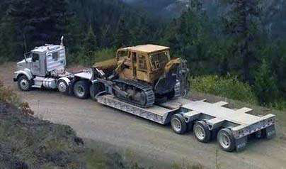 Heavy equipment loaded on a trailer