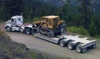 Heavy equipment loaded on a trailer