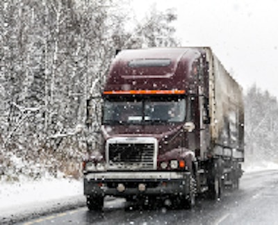 Semi truck driving in the snow