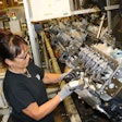 An employee at the DMAX, LTD engine plant assembles Duramax dies