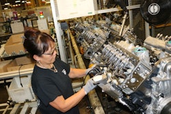 An employee at the DMAX, LTD engine plant assembles Duramax dies