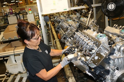 An employee at the DMAX, LTD engine plant assembles Duramax diesel engines in Moraine, Ohio.