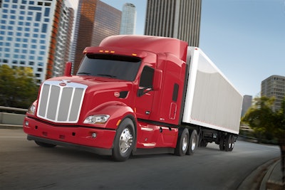 Big truck driving down the road