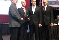 At the TWNA awards ceremony are (left to right) Jim Park, chairman of the TWNA awards committee; Tim Proctor, X15 technical director, Cummins; Jim Nebergall, X15 program director, Cummins; and Mario Sanchez-Lara, communications director, Cummins.