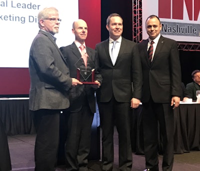 At the TWNA awards ceremony are (left to right) Jim Park, chairman of the TWNA awards committee; Tim Proctor, X15 technical director, Cummins; Jim Nebergall, X15 program director, Cummins; and Mario Sanchez-Lara, communications director, Cummins.