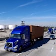 Three Volvo VNL 670 tractors hauled cargo containers from the Port of Los Angeles along Interstate 110 in Southern California.
