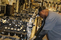 An employee at the DMAX, LTD engine plant assembles Duramax diesel engines in Moraine, Ohio.